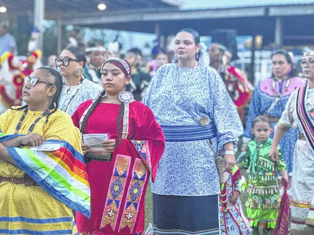 Generations of Coharie women, dressed in colorful garments, participate in the Grand Entry.
                                 Dylan Atwood | Sampson Independent