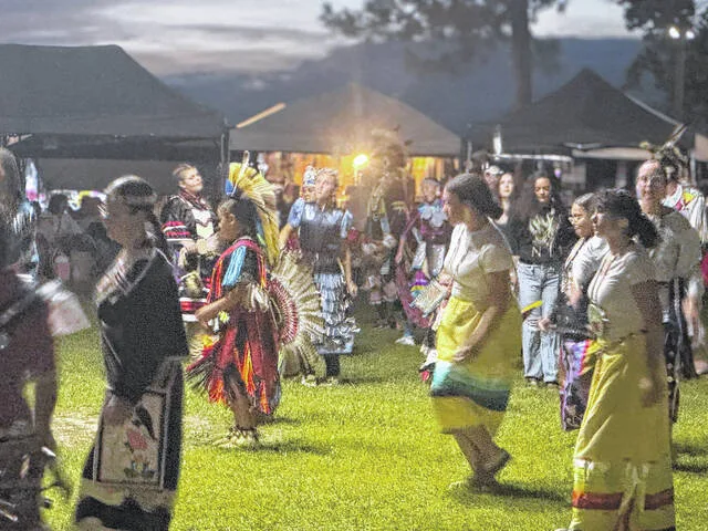 Women dance Saturday evening as part of continued Pow Wow events.
                                 Dylan Atwood | Sampson Independent
