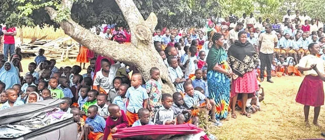During school visits organized by the Mombasa Relief Initiative, items are distributed to children such as those pictured. In return, students welcome the visitors with assembly-style programs showcasing their talents and what they had learned through songs, recitations, and presentations in English and Swahili.
                                 Courtesy photo | Jacqueline Howard