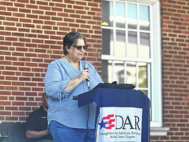 Angela Tousey, regent for the Richard Clinton Chapter NSDAR, speaks about patriots of Americas past, including men and women, during the National Ringing of the Bell Ceremony Thursday afternoon outside the Sampson County Courthouse.
                                 Dylan Atwood | Sampson Independent