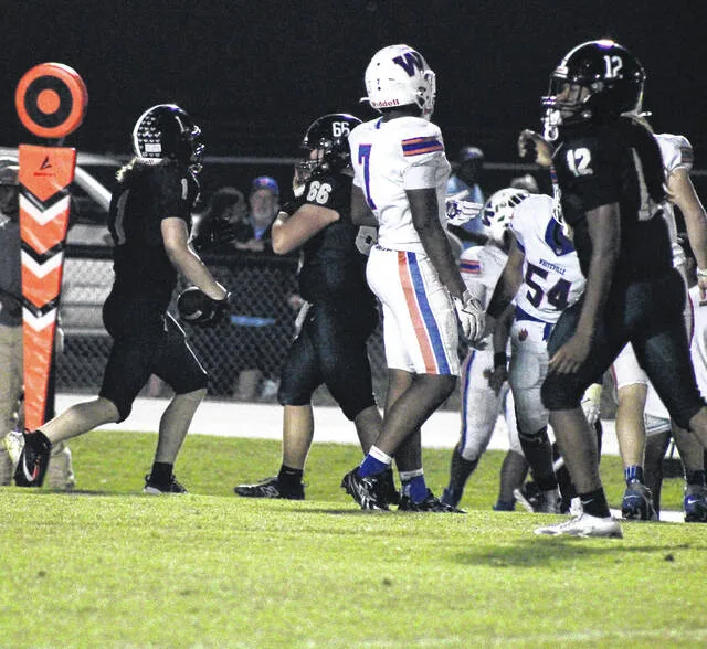 Dark Horse tight end Bryson Mozingo catches the ball against Whiteville.