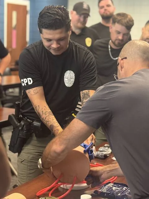 Cpl. Ricardo Rico and Dr. Andres Fleury, M.D., practice wrapping a tourniquet around a leg.
Dylan Atwood | Sampson Independent