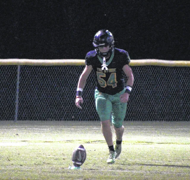 Crusader senior kicker Sam McKeithan in mid-run-up before the kickoff.