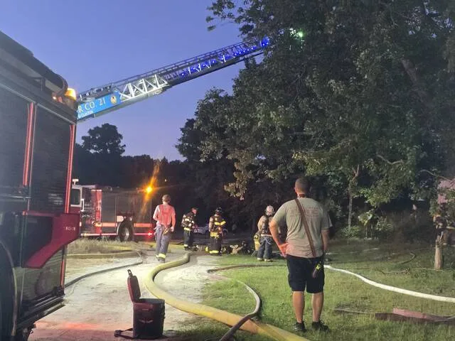 Clintons ladder truck was used to allow firefighters to pierce through the wooded area of Big John Lane to reach the one-and-a-half story structure, which was destoyed in the fire. This is the second fire at the structure since 2013.